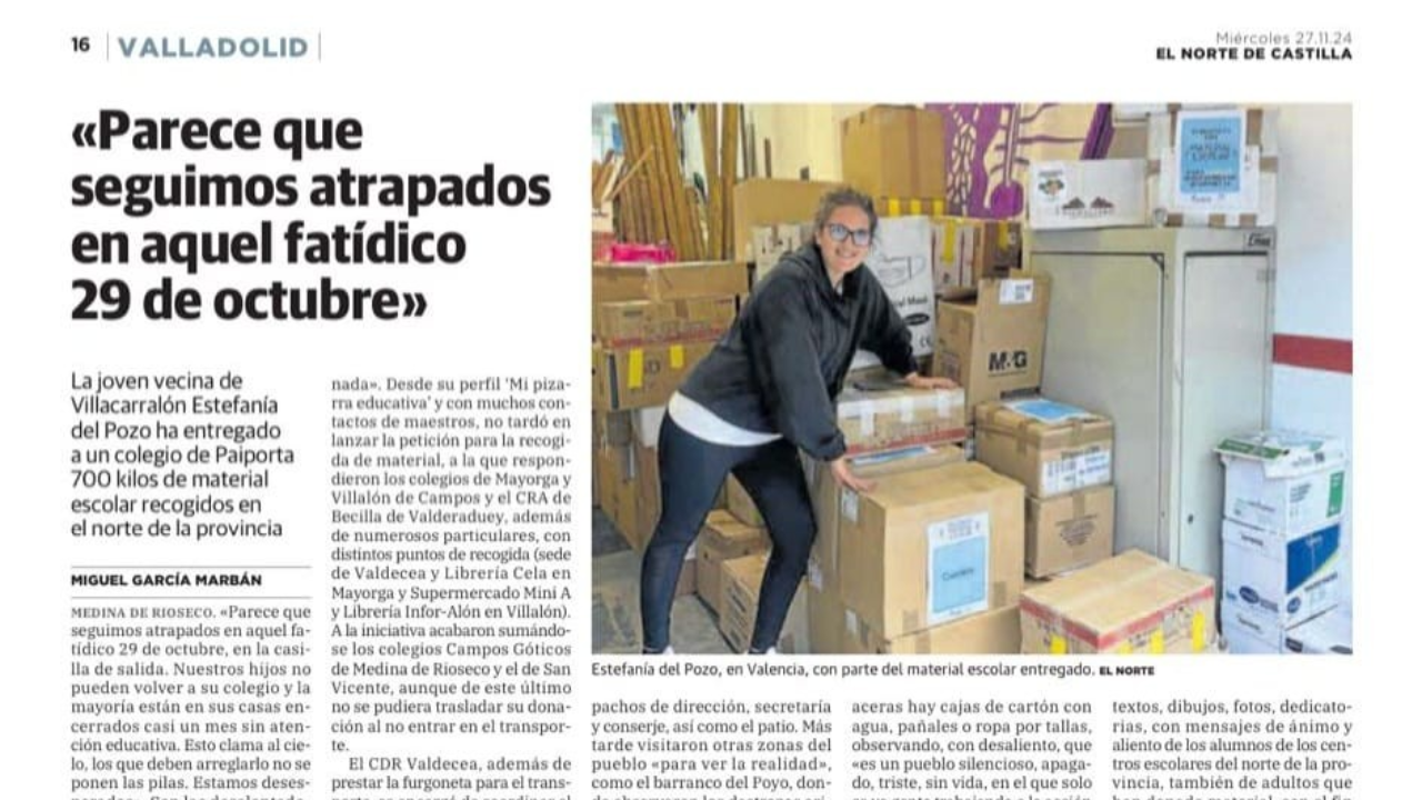 Recorte de prensa con la entrevista y una foto de una mujer entre cajas